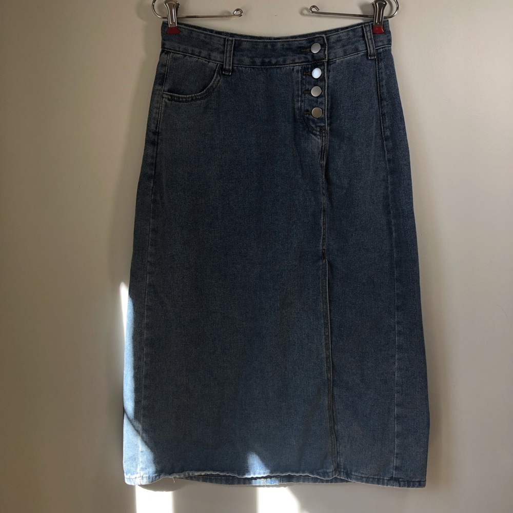 Denim Midi Skirt off center button fly and pocket. Front slit. Western pencil